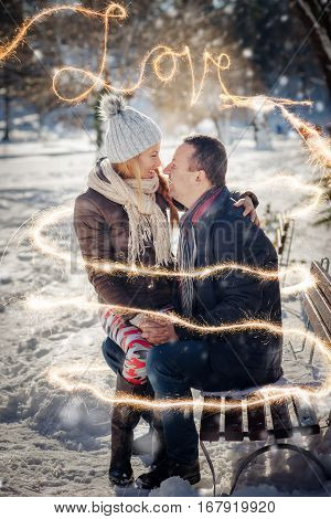 smiley lovers couple with sparklers happiness at winter time.St. Valantine