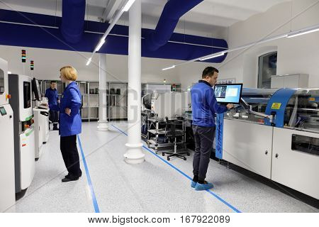 ST. PETERSBURG, RUSSIA - NOVEMBER 2, 2016: People at work on the production site of StarLine company. It is one of the leading company on the automotive security market of Russia