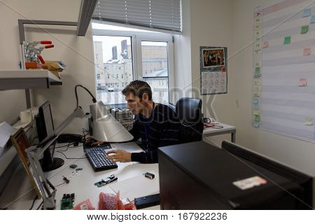 ST. PETERSBURG, RUSSIA - NOVEMBER 2, 2016: People at work in the development department of StarLine company. It is one of the leading company on the automotive security market of Russia