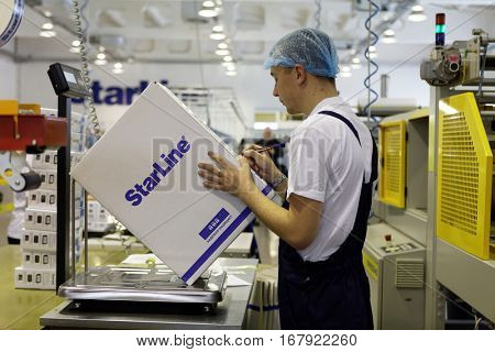 ST. PETERSBURG, RUSSIA - NOVEMBER 2, 2016: People at work in the department of packaging of products of StarLine company. It is one of the leading company on the automotive security market of Russia