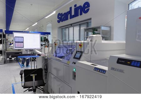 ST. PETERSBURG, RUSSIA - NOVEMBER 2, 2016: People at work on the production site of StarLine company. It is one of the leading company on the automotive security market of Russia