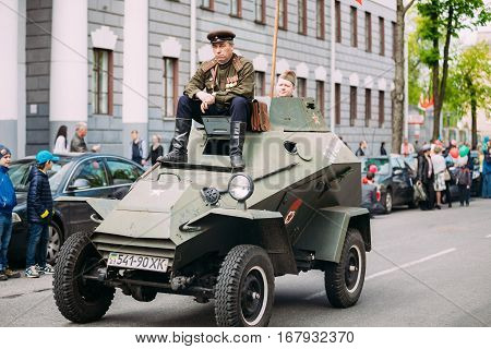 Gomel, Belarus - May 9, 2015: Parade Of Russian Soviet Military Warfare Of WW2 Time With Re-Enactors Dressed As Red Army Soldiers. BA-64 Is A Small Lightly Armoured Soviet Scout Car
