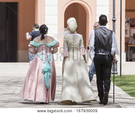 CAGLIARI, ITALY - June 1, 2014: Sunday at La Grande Jatte public gardens - Sardinia - group of people parading in Victorian costumes