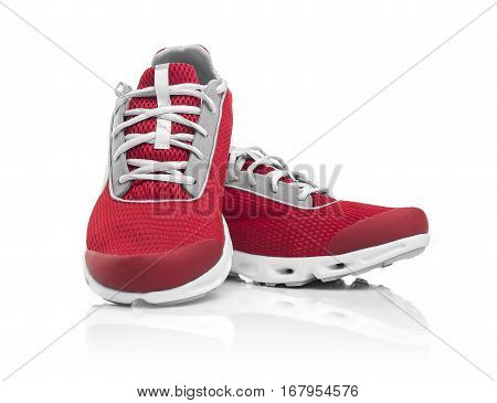 Unbranded modern sneakers isolated on a white background. Red sneakers.