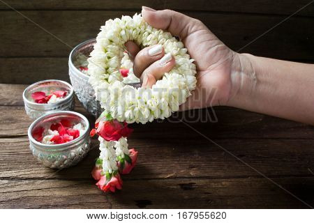 Water in bowl mixed with perfume and flowers corolla for Songkran festival in Thailand.