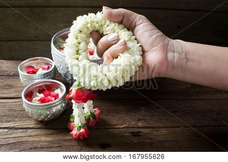 Water in bowl mixed with perfume and flowers corolla for Songkran festival in Thailand.