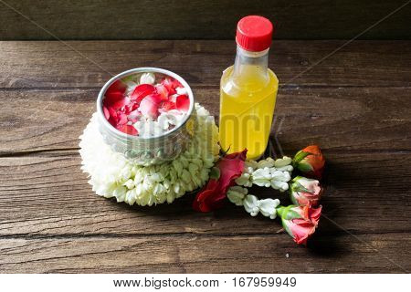 Water in bowl mixed with perfume and flowers corolla for Songkran festival in Thailand.