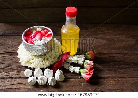 Water in bowl mixed with perfume and flowers corolla for Songkran festival in Thailand.