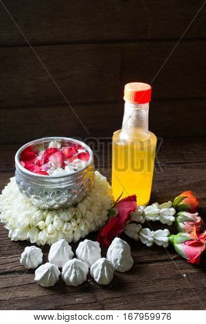 Water in bowl mixed with perfume and flowers corolla for Songkran festival in Thailand.