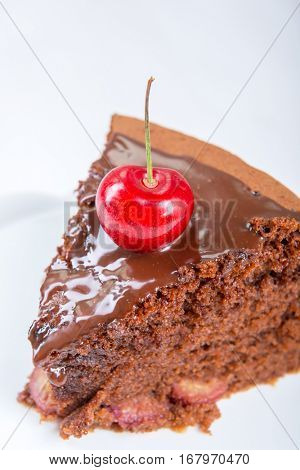 Chocolate cake with juicy cherries