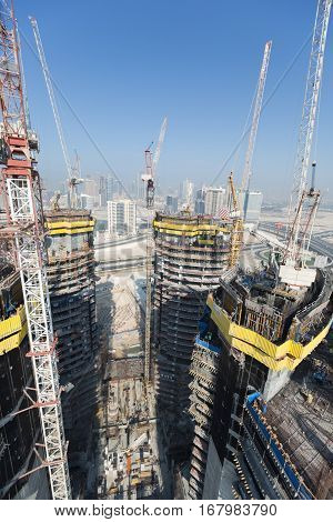 United Arab Emirates, Dubai, 05/21/2015, Damac Towers Dubai by Paramount, construction and building ariel views with cityscape background