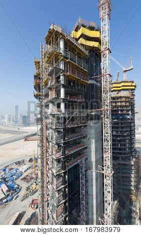 United Arab Emirates, Dubai, 05/21/2015, Damac Towers Dubai by Paramount, construction and building ariel views with cityscape background