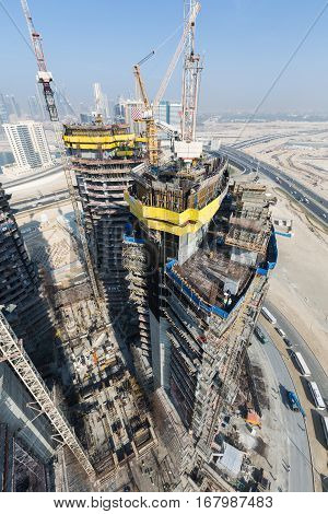 United Arab Emirates, Dubai, 05/21/2015, Damac Towers Dubai by Paramount, construction and building ariel views with cityscape background