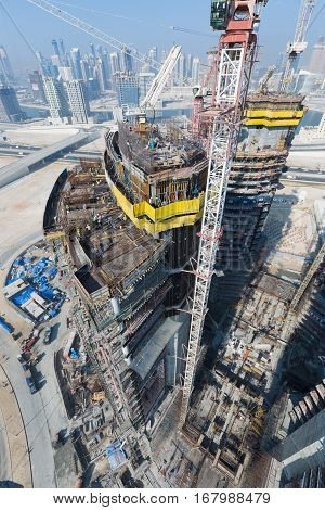 United Arab Emirates, Dubai, 05/21/2015, Damac Towers Dubai by Paramount, construction and building ariel views with cityscape background