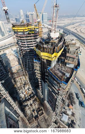United Arab Emirates, Dubai, 05/21/2015, Damac Towers Dubai by Paramount, construction and building ariel views with cityscape background