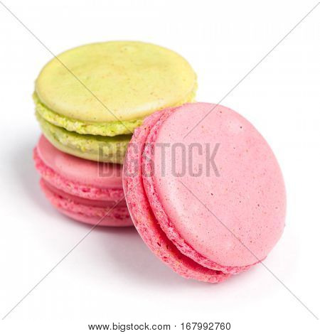 Tasty macaroons in two colors isolated on white background