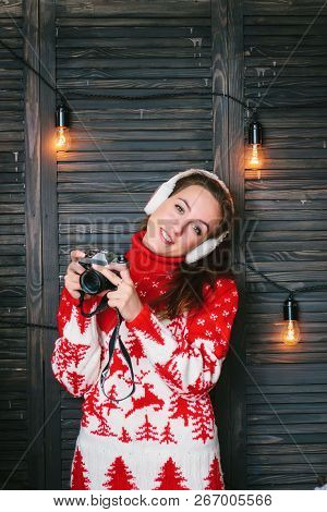 Girl With A Cameara In Hands During New Year Celebration - Christmas And New Year Concept.