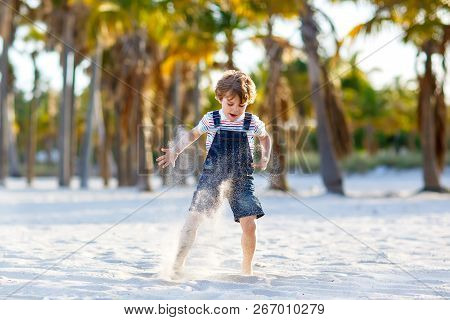 Adorable Active Little Kid Boy Having Fun On Miami Beach, Key Biscayne. Happy Cute Child Relaxing, P