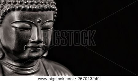 Buddha statuette in the act of meditating (Black and White with copy space)