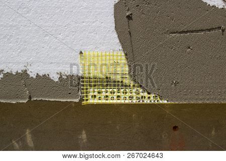 The Corner Is Perforated On The Facade, Glued Corner Perforated With A Grid On The Facade Of The Hou