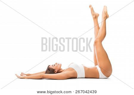 Mid Adult Woman With Eyes Closed Wearing Lingerie While Resting On White Background