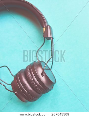 Wireless Headphones On Colorful Blue Background. Vertical 4x5 Crop