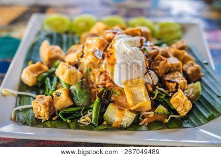 Gado-gado Indonesian Salad Served With Peanut Sauce. Ingredients: Tofu, Spinach, String Beans, Soy S
