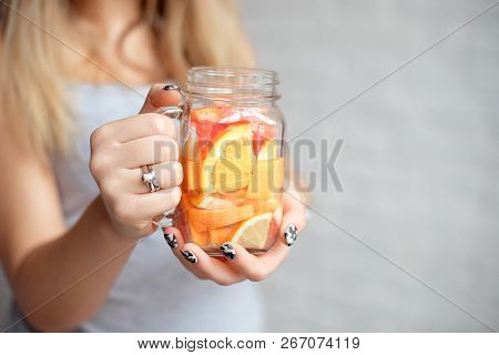 Close-up Happy Woman With Glass Of Fresh Summer Lemonade With Straw. Caucasian Young Girl 20-25 Year