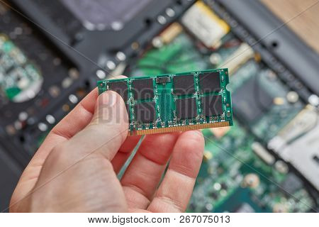 Installing memory module in a laptop computer
