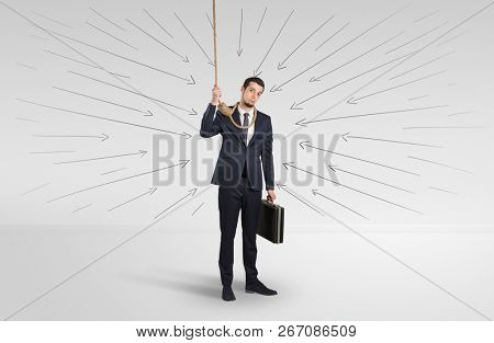 Hopeless young businessman trying to suicide with question signs concept