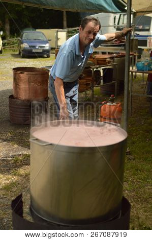 Cook Preparing In A Copper Octopus Pot At Becerrea Octopus Fair. Kitchen, Food, Travel, Professions,