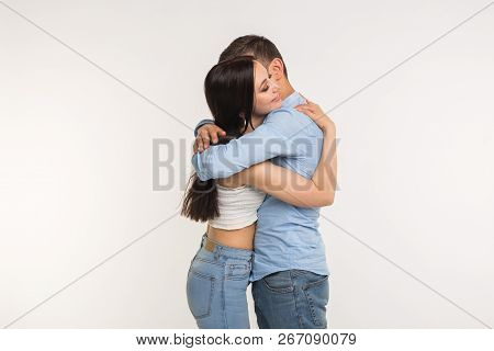 Handsome Man Hugging His Girlfriend On White Background