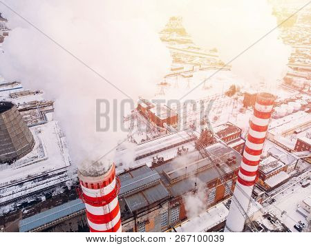 Aerial Top View Clouds Of Smoke And Steam Cooling Tower Industrial Heat Electro Central Coal. Enviro