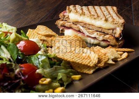 Turkish Toast Or Tost / Triangle Club Sandwich With Melted Cheese, Ham And Served With Chips And Sal
