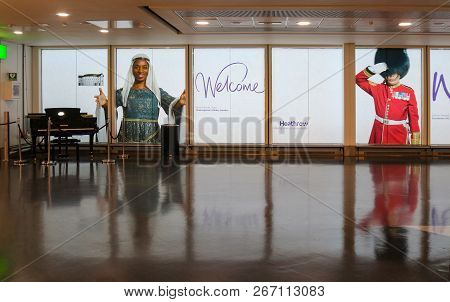 Welcome To Heathrow Airport - View With Grand Piano And Images Of Multicultural People Greeting Trav