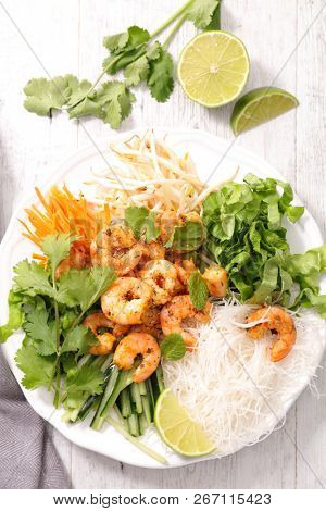 asian meal with shrimp, noddles and vegetables