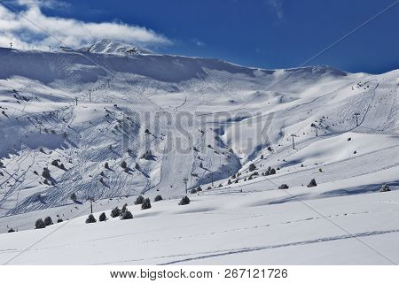 View Of The Mountain Slopes With Ski Slopes In The Pyrenees, Andorra. On The Slopes Of The Prepared 