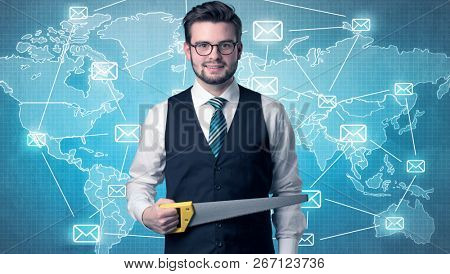 Businessman holding tool with global map graphic on the background