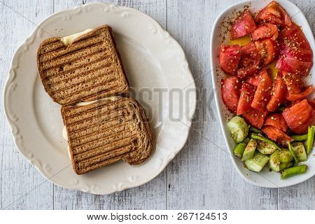 Turkish Toast (tost) With Melted Cheese, Tomatoes And Cucumber.
