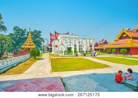Mandalay, Myanmar - February 23, 2018:  The Kids Play At The Courtyard Of The Royal Palace, Next To 