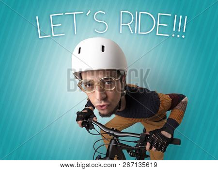 Kooky young guy on a bike with cyclist keywording and streaky background