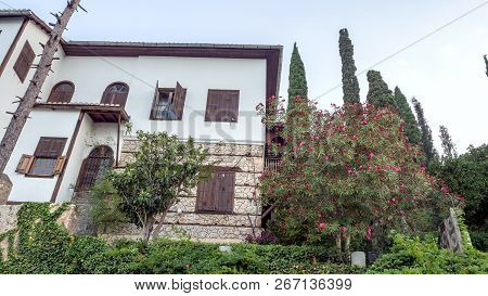 Green Trees Near The Stone House Of Alanya, Turkey. Trees And Old Buildings. Summer Concept And Copy