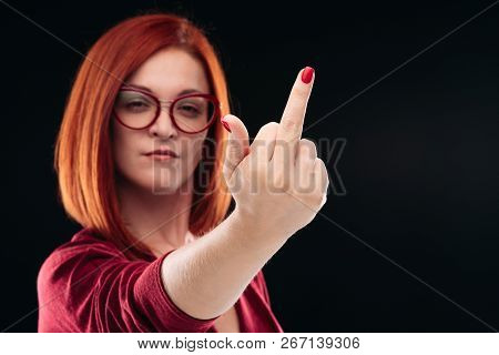 Confident And Angry Red Haired Girl Showing Finger, Gesturing Fuck Off.
