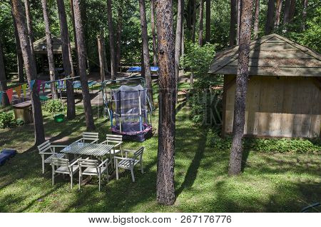Lozen Mountain, Bulgaria - June 11, 2018: Summer Child Public Bivouac  With Table, Chair, House And 