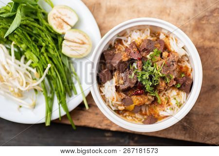 Northern Thai Food (kanom Jeen Nam Ngeaw) With Vegetables On Wooden Background,spicy Rice Noodles So