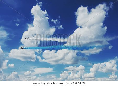 Two Il-76 Planes Produce Blue And White Smoke In The Clouds In The Sky Over Russia. Russian Aviation