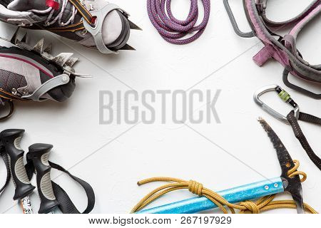 Photo On Top Of Boots, Ski Poles, Pickaxe, Picks On White Background. Place For Text.