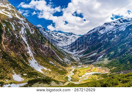 Mountain River In Alps Covered With Snow, Fluelapass, Zernez, Graubuenden, Switzerland