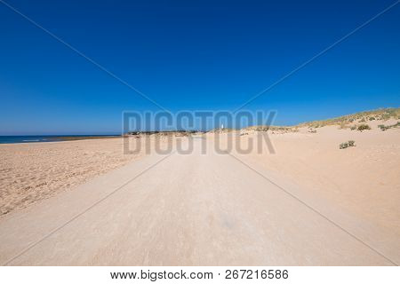 Lonely Sand Track To Trafalgar Cape In Cadiz