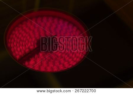 Electric Stove Powered Up, Red Hotplate Glows Red On Black Bachground, Being On